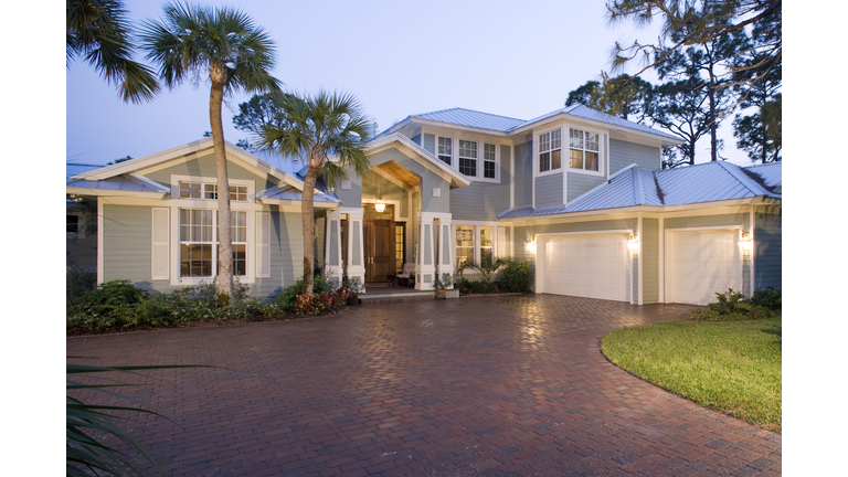 Front exterior of modern house at sunset