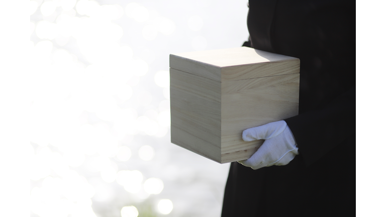 Mourner holding urn