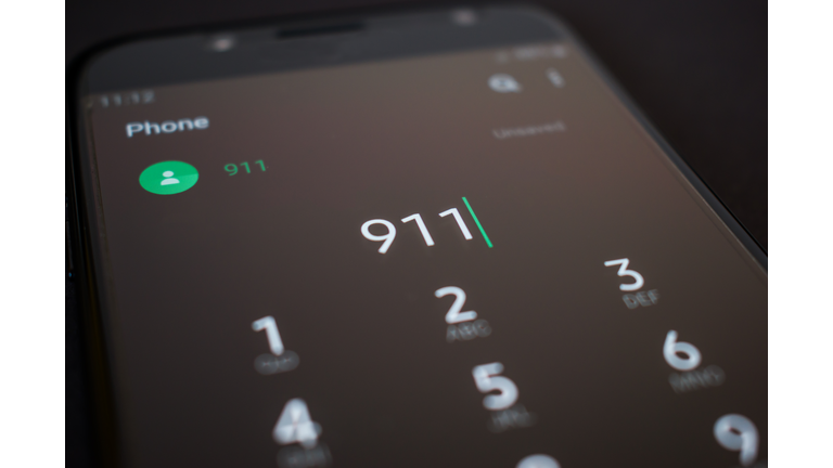 Emergency 911 call on smartphone, mobile phone, close up