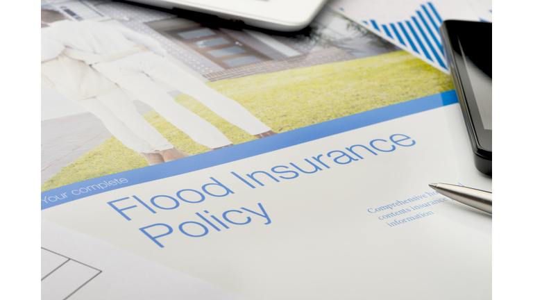 Flood insurance policy brochure with image of a couple