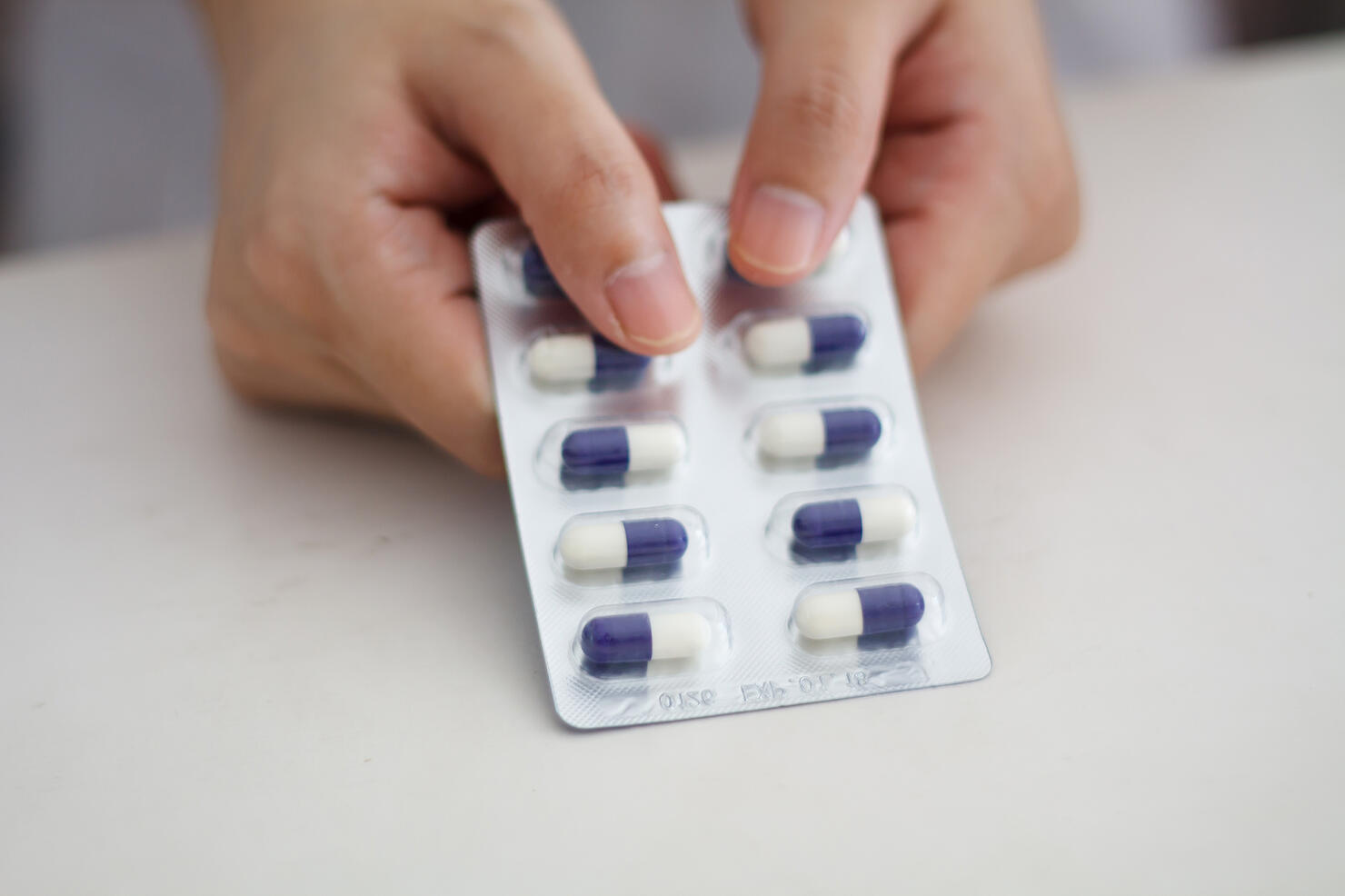 Close up of female doctor hands holding pills