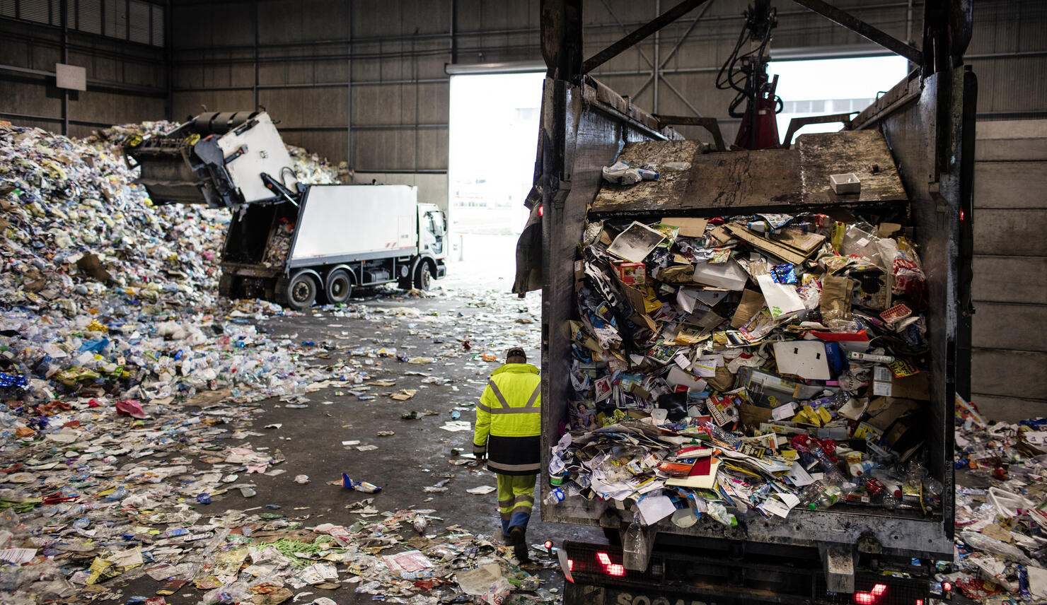 dumping trucks at a recycling plant