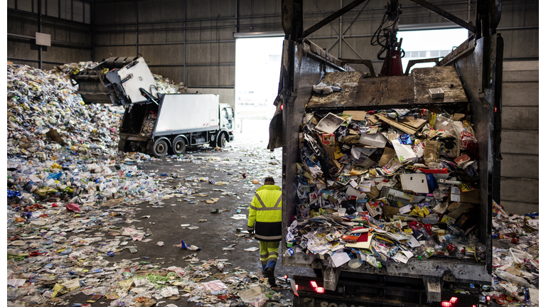 dumping trucks at a recycling plant