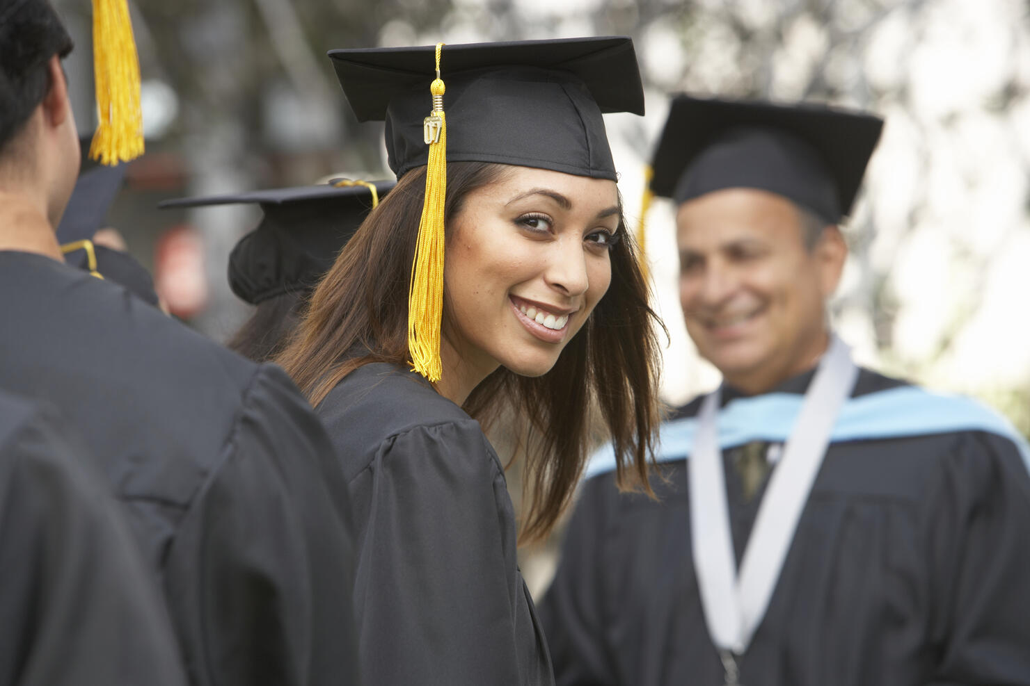 Female graduate student at graduation ceremony, portrait
