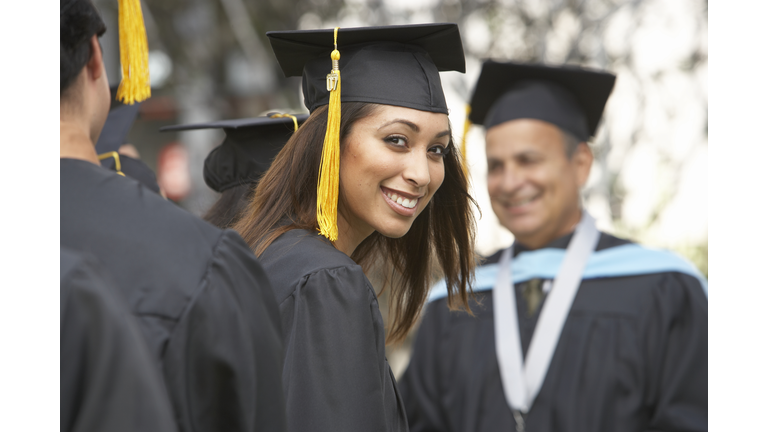 Female graduate student at graduation ceremony, portrait