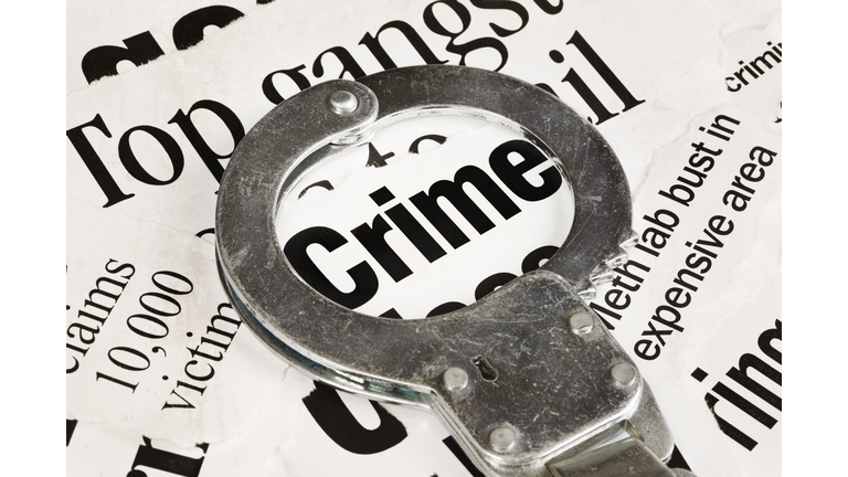 Worn old handcuff sits on &quot;Crime&quot; headlines