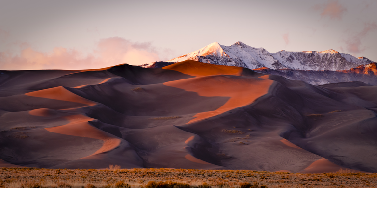 Sand dunes and mountain peaks. Great Sand Dune National Park, Alamosa, Colorado.