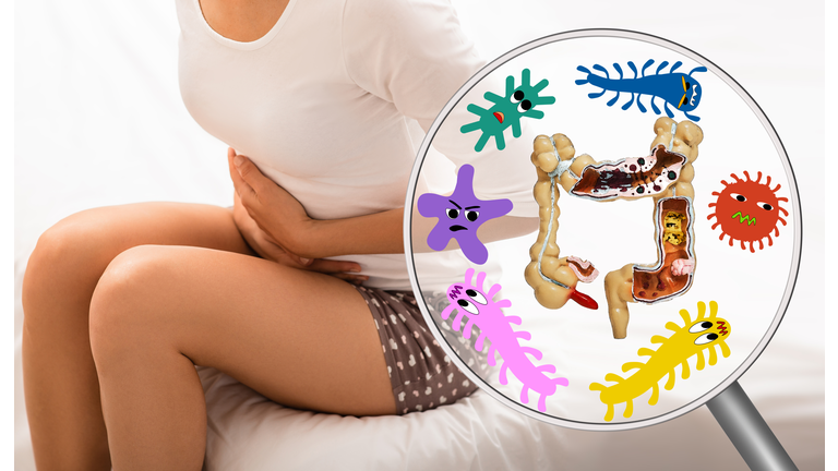 Pain in woman's intestines and abdomen. Dysbacteriosis, inflammation of intestines, abdominal bloating