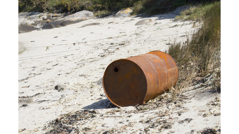 rusty oil barrel abandoned -  Coastline pollution