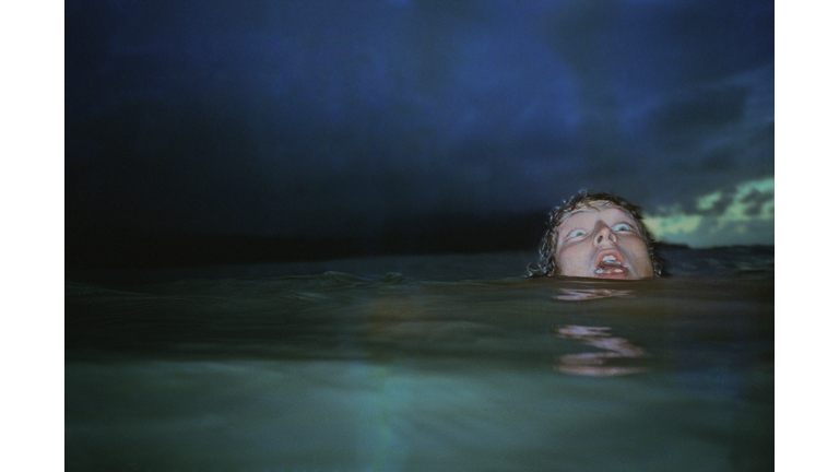 Man showing fear, head barely above water