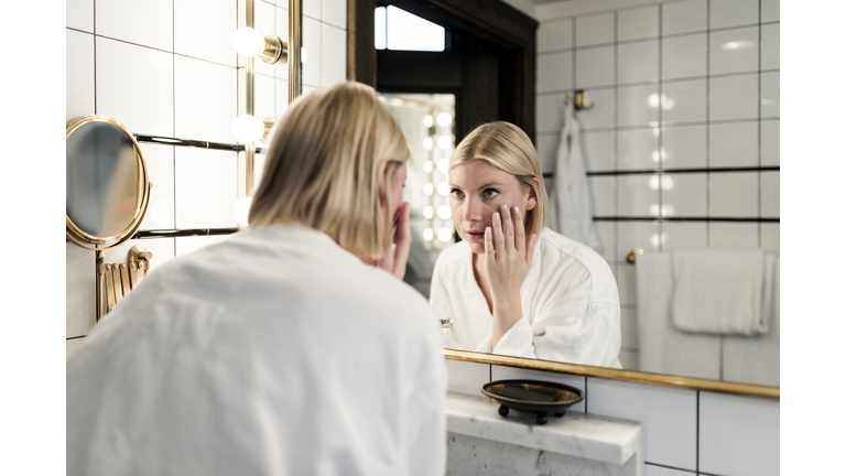 Blond woman in bathroom