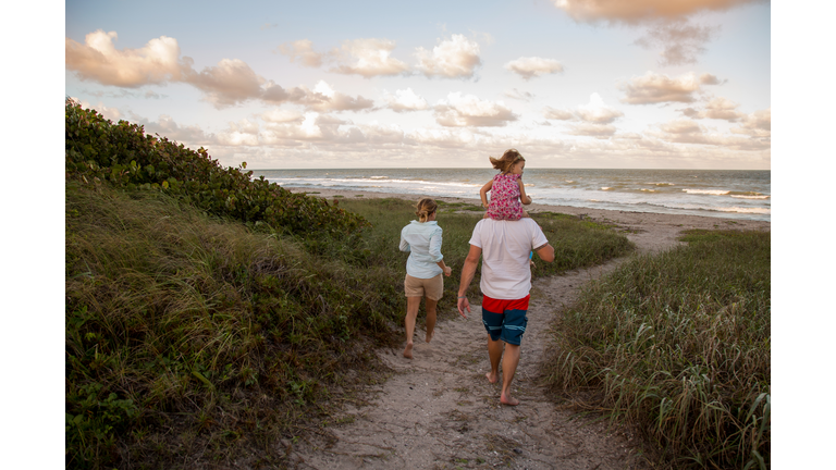 Family walking on coastal path, Blowing Rocks Preserve, Jupiter, Florida, USA