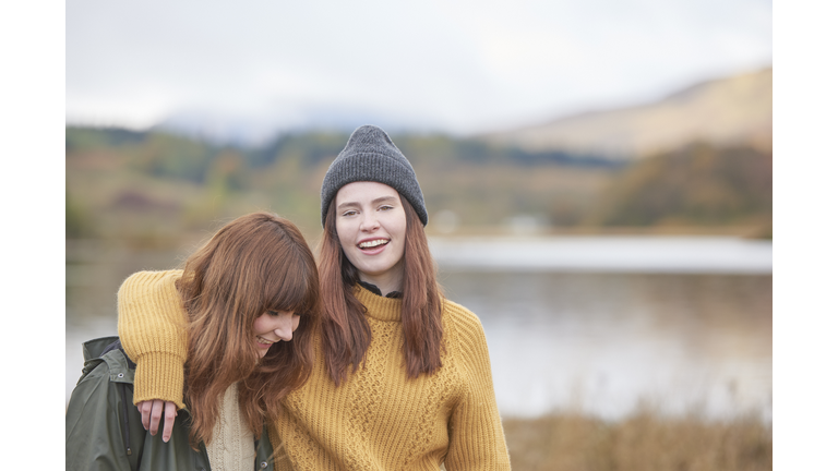 Two girls arm in arm