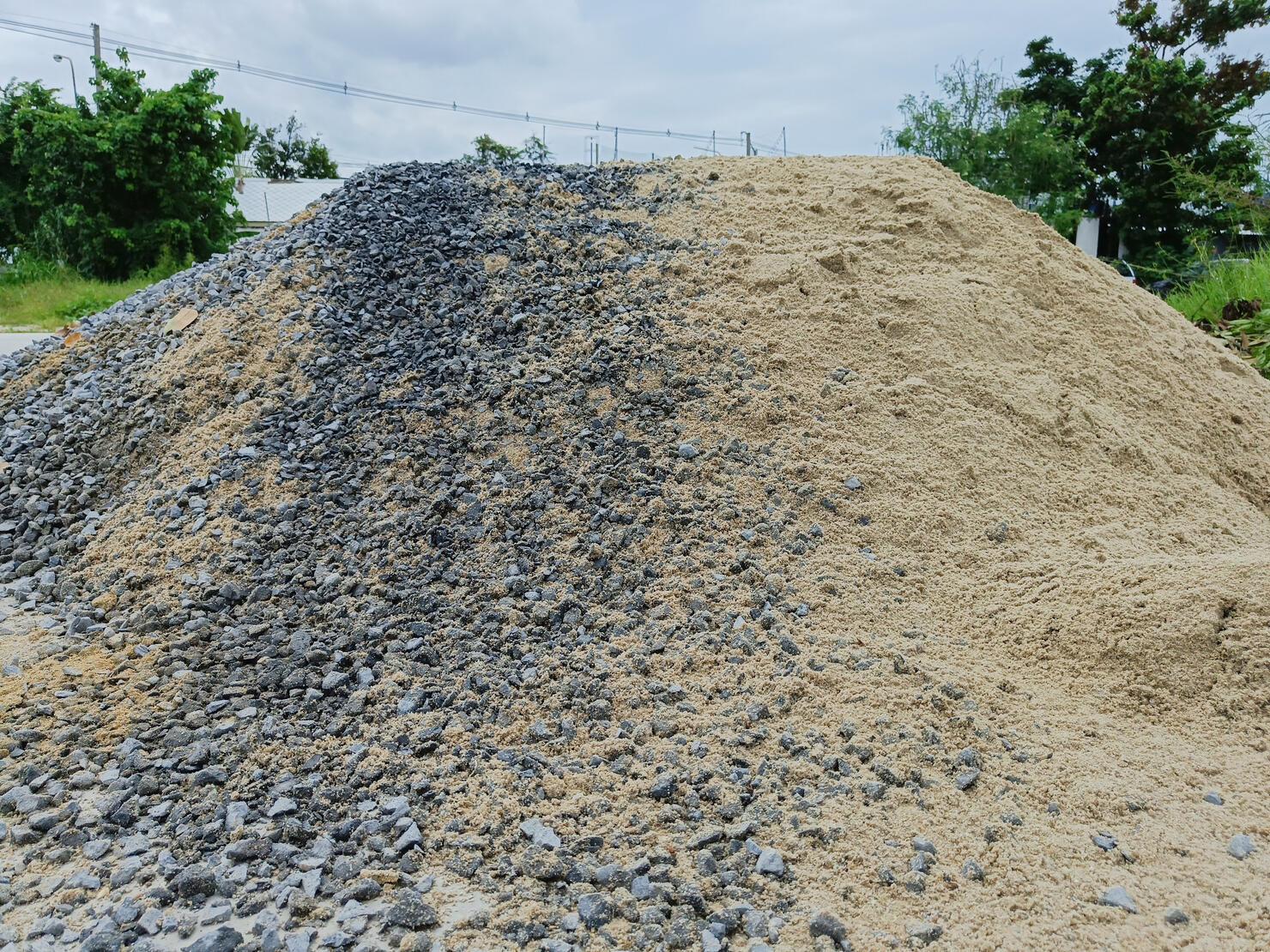 Pile of gravel or stone and sand for construction