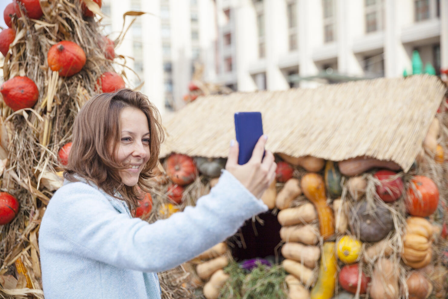 Selfie on the background of pumpkins