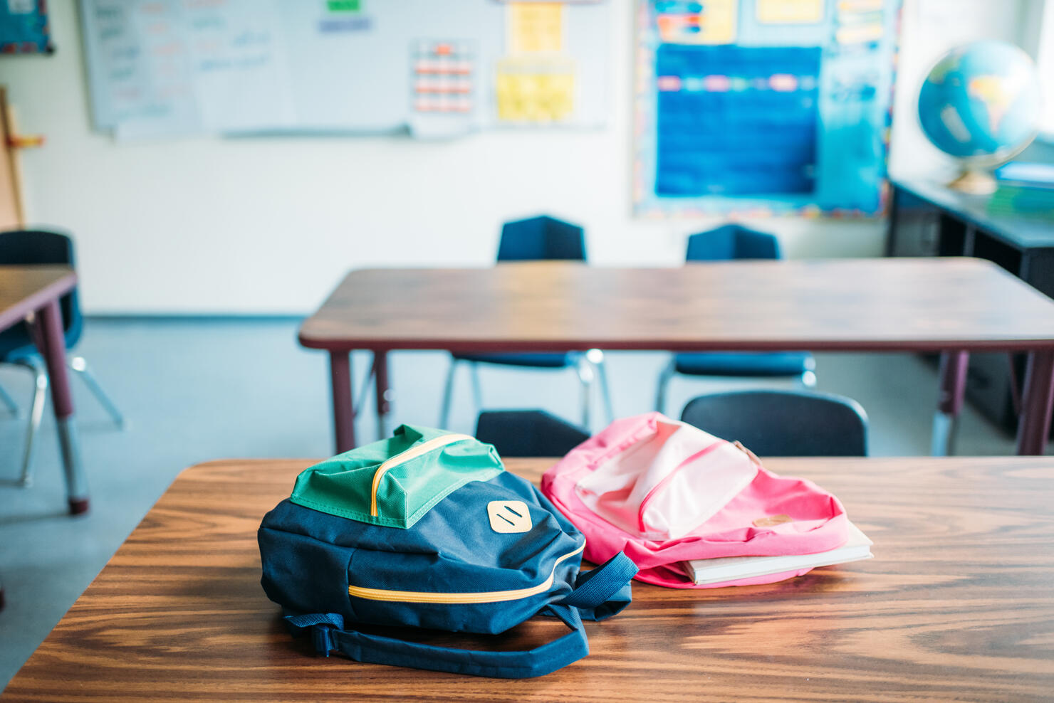 backpacks laying on desk