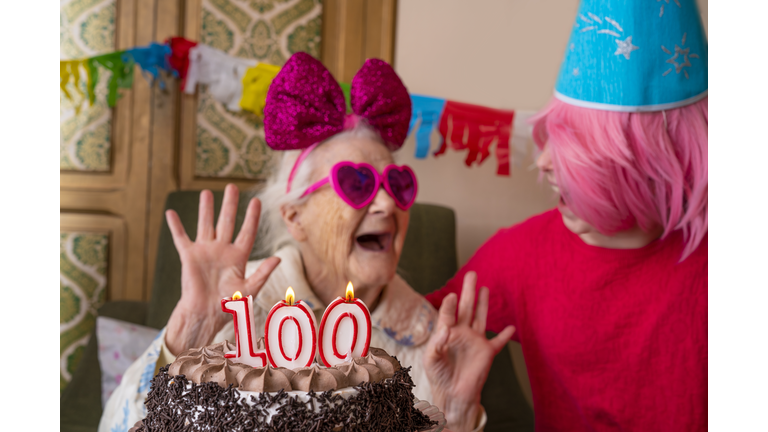 100 years old birthday cake to old woman elderly