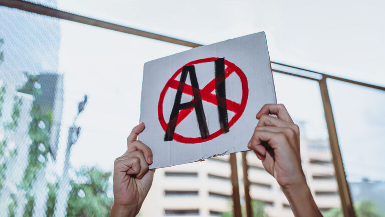 Protestor holding "No AI" placard