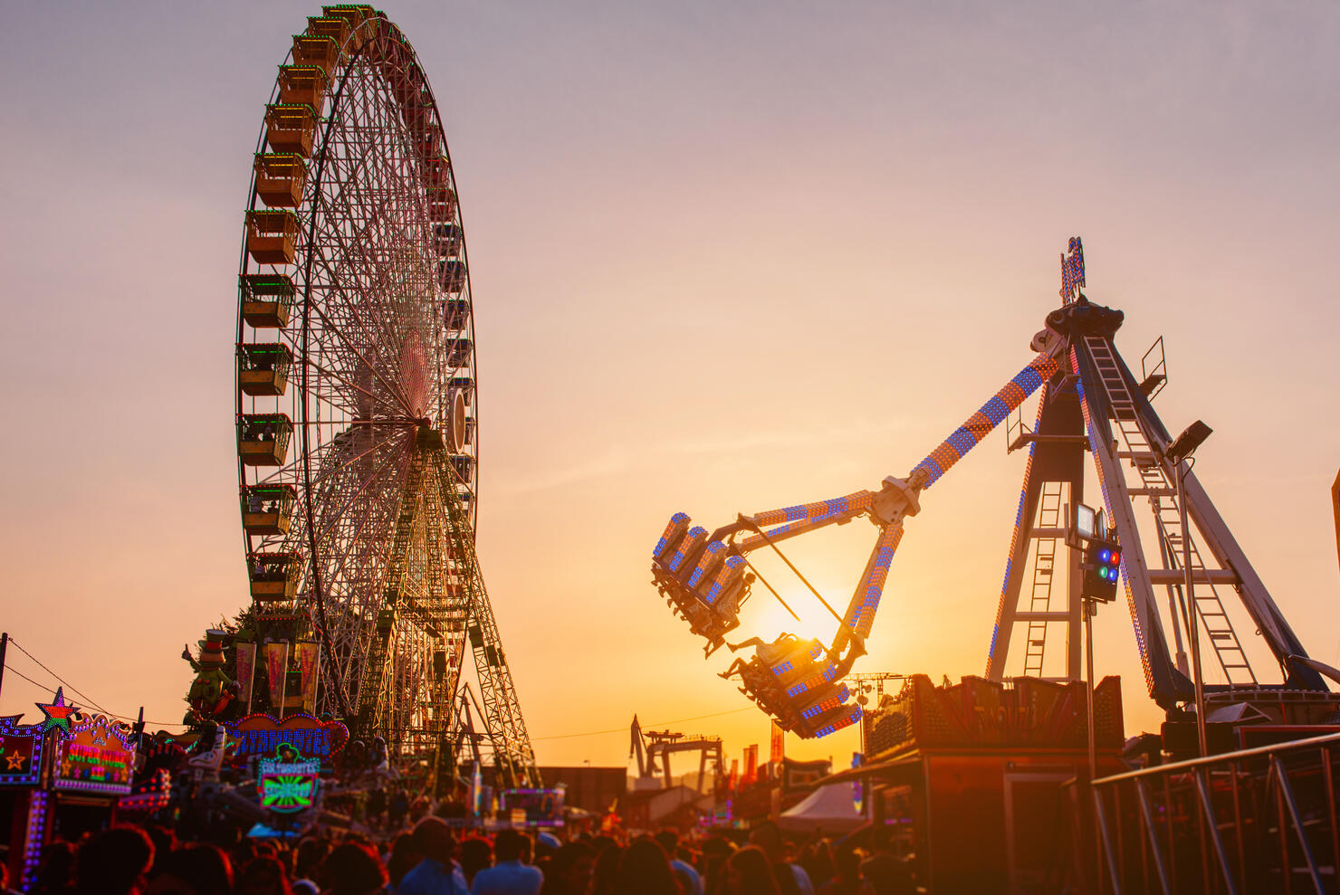 fairground rides at sunset