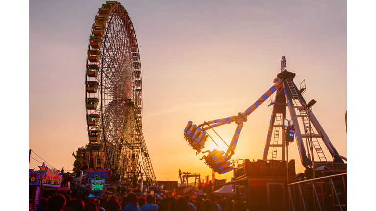 fairground rides at sunset