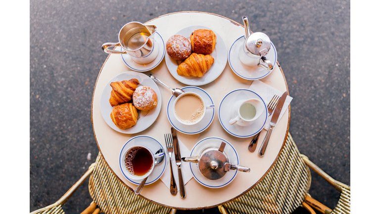 Fresh croissants, coffee and tea in French cafe, Paris, France