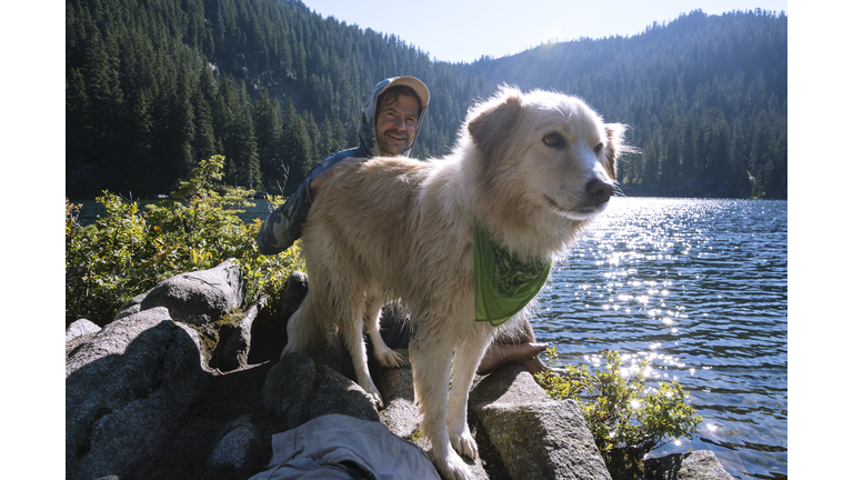 Closeup of dog next to an alpine lake