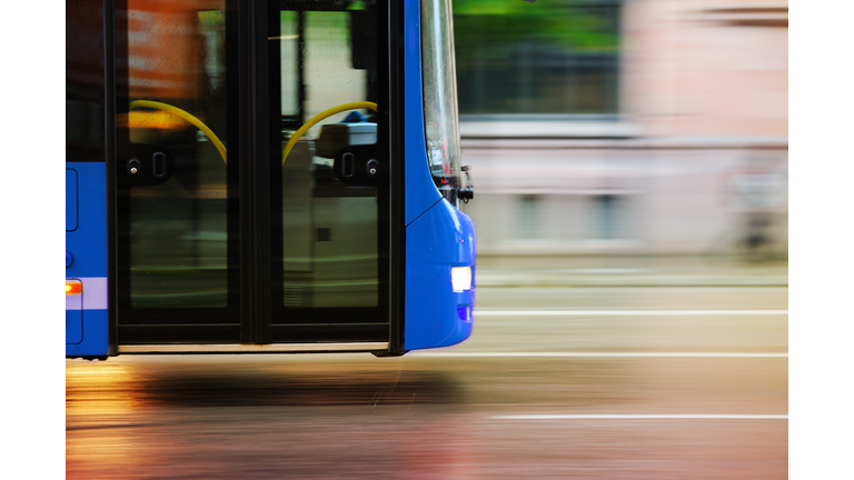 Flying bus in the city traffic, rush hour