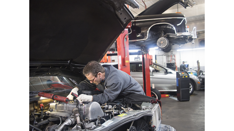 Mechanic works on auto