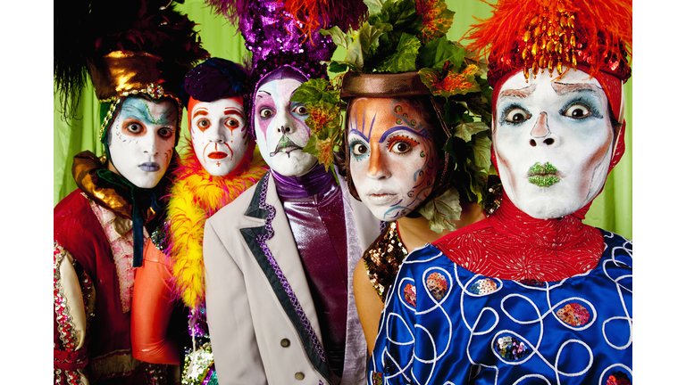 Clowns wearing theatrical makeup