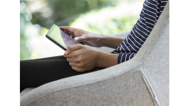 Close up of a young girl using a tablet computer