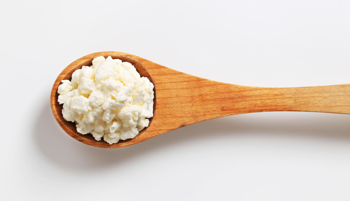 cottage cheese on a wooden spoon