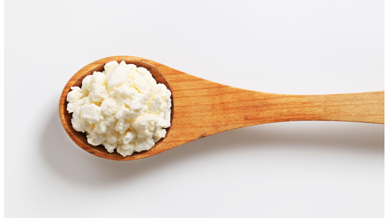 cottage cheese on a wooden spoon