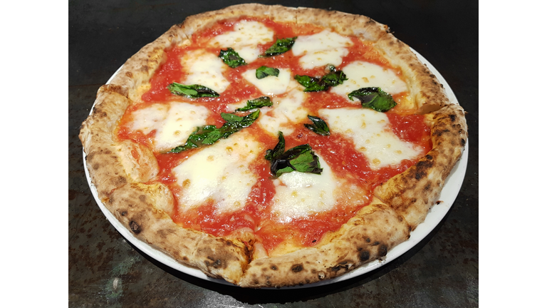 Close-up shot of wood-fired oven margarita pizza