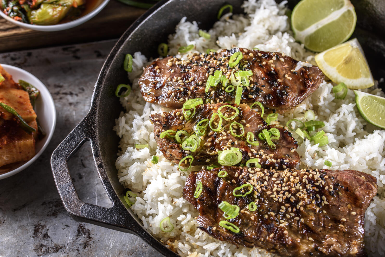 Delicious Grilled Kalbi on over Steamed Rice in Cast Iron Pan