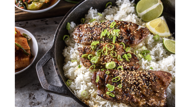 Delicious Grilled Kalbi on over Steamed Rice in Cast Iron Pan