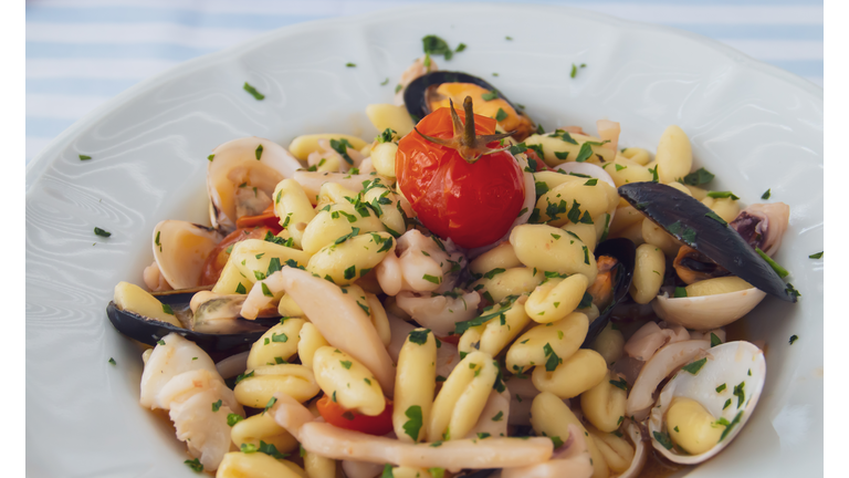 Cavatelli pasta dish with seafood in Polignano a Mare, Italy.
