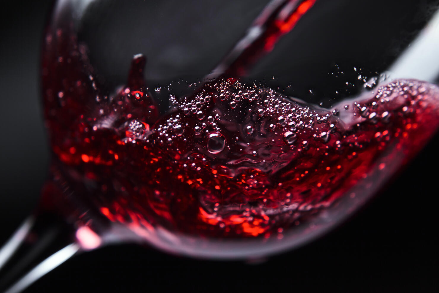 Red wine being poured into wine glass