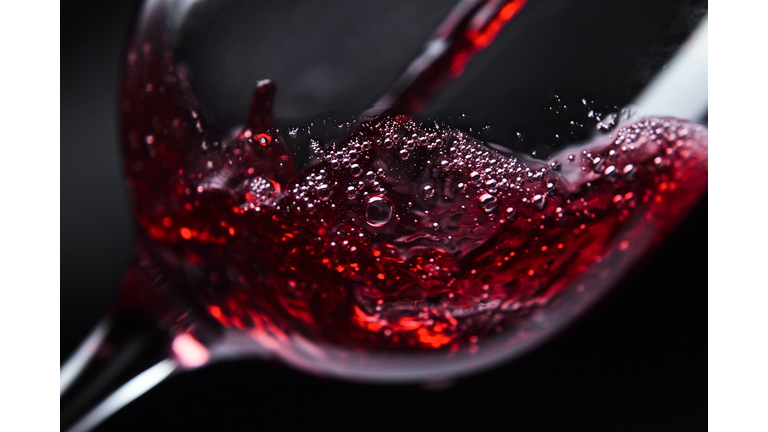 Red wine being poured into wine glass