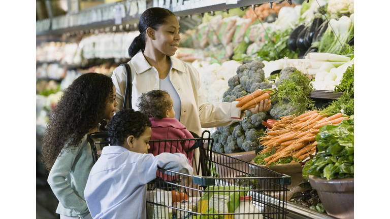 Family shopping for groceries in supermarket