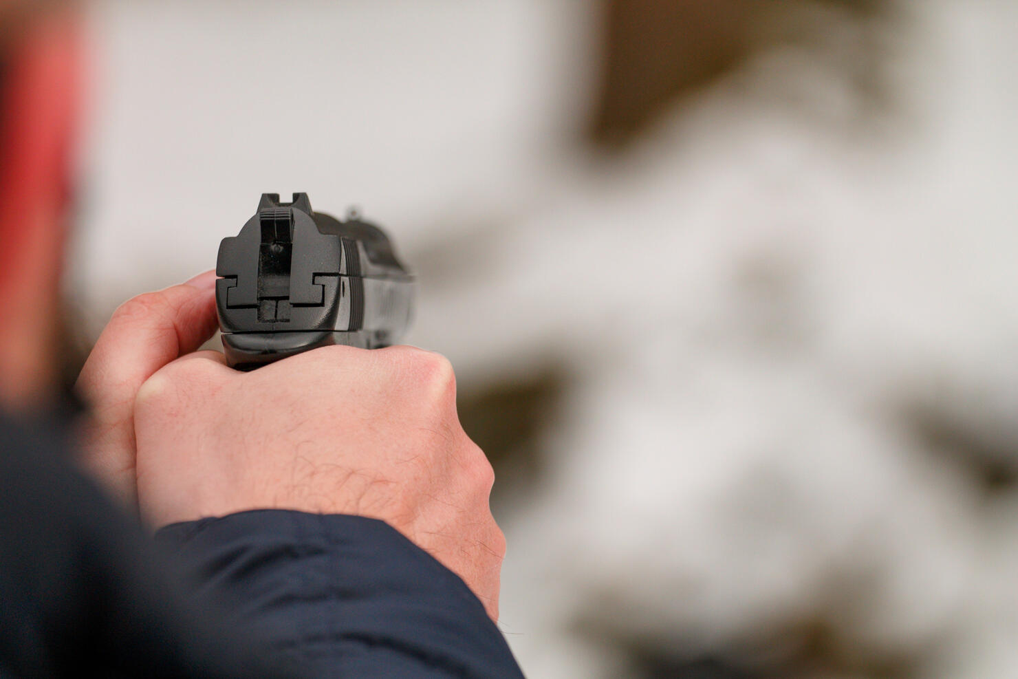 Shooting a gun.