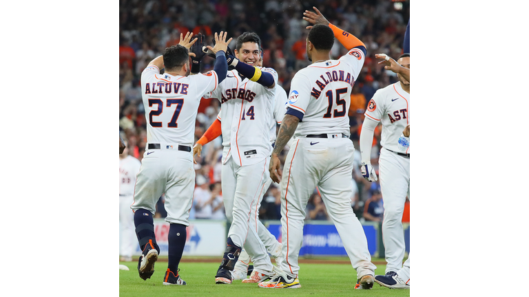 Houston Astros shortstop Mauricio Dubon (14) hits an RBI single to left  field in the bottom of the fifth inning of the MLB game between the Houston  As Stock Photo - Alamy