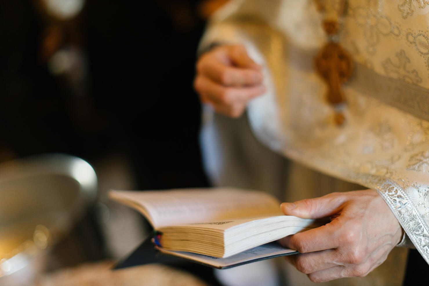 close up of priest's hands - stock photo