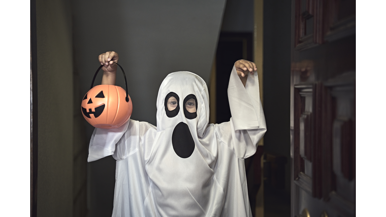 Trick or Treat; little boy dressed as a ghost