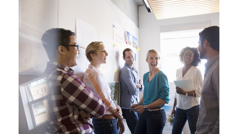 Business people laughing in meeting