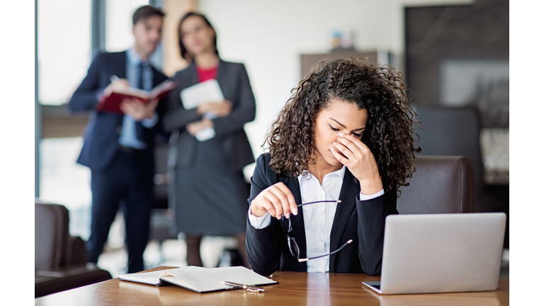 Portrait of burnout businesswoman in an office