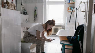  Why You Shouldn't Take Your Phone to the Bathroom, According to a Doctor