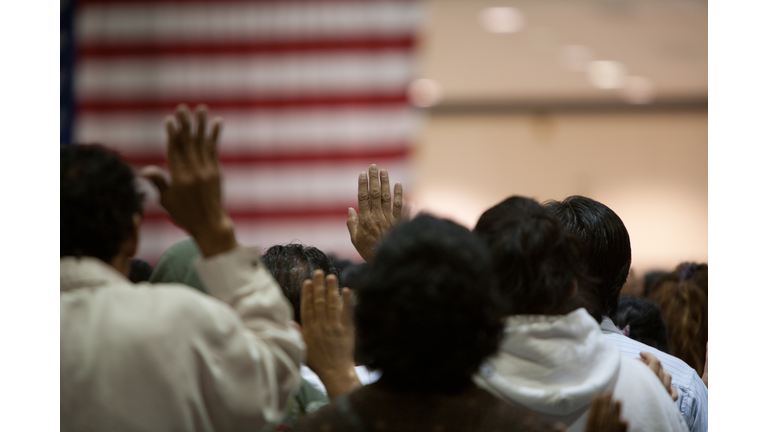 Immigrants at a swearing in ceremony