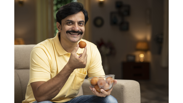 man eating sweet food, stock photo