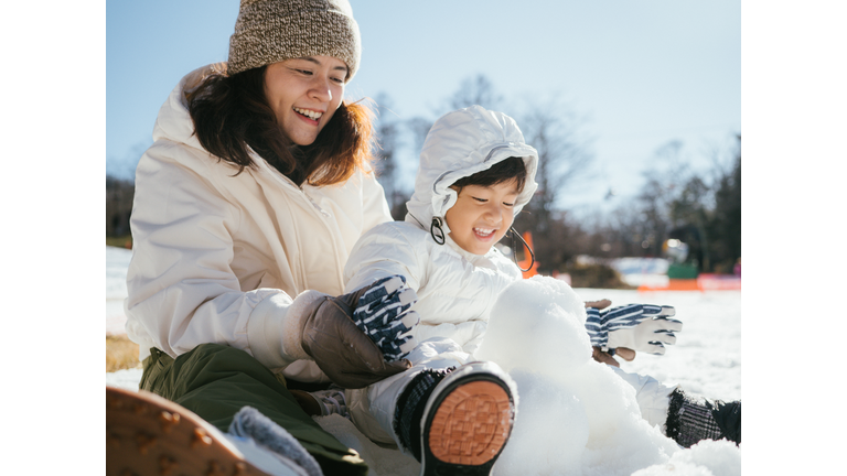 Family Building A Snowman