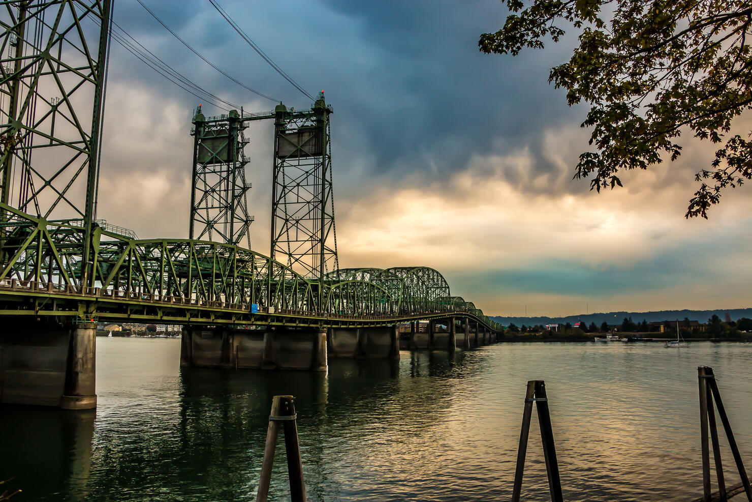 Colorful Sunset Over Columbia River Oregon Washington Bridge Dense Clouds